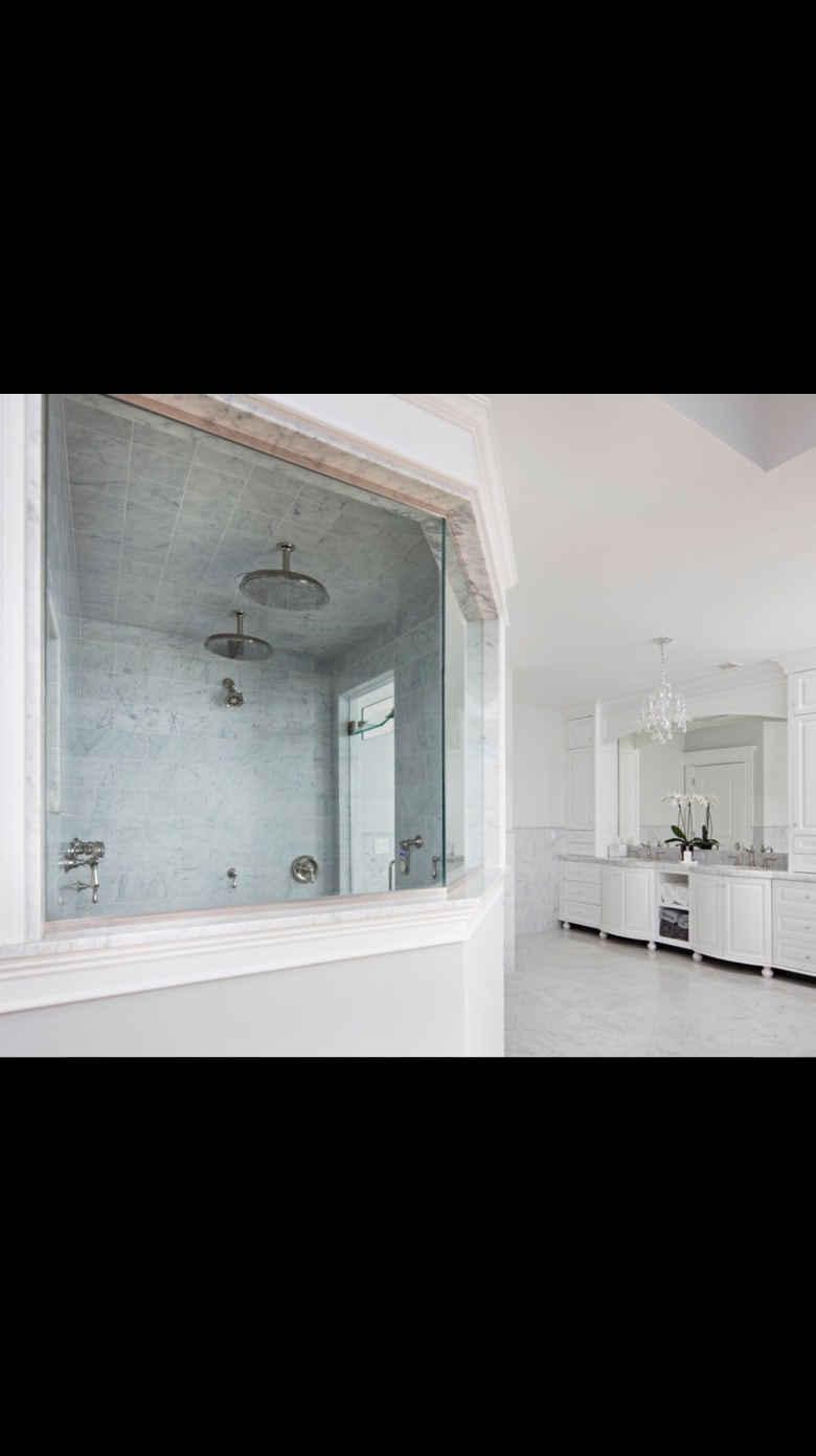 Luxury marble shower with dual rainfall heads — Cole James Builders