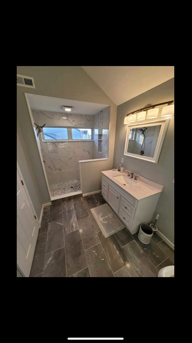 Bathroom remodel with marble tile and walk-in shower — Cole James Builders
