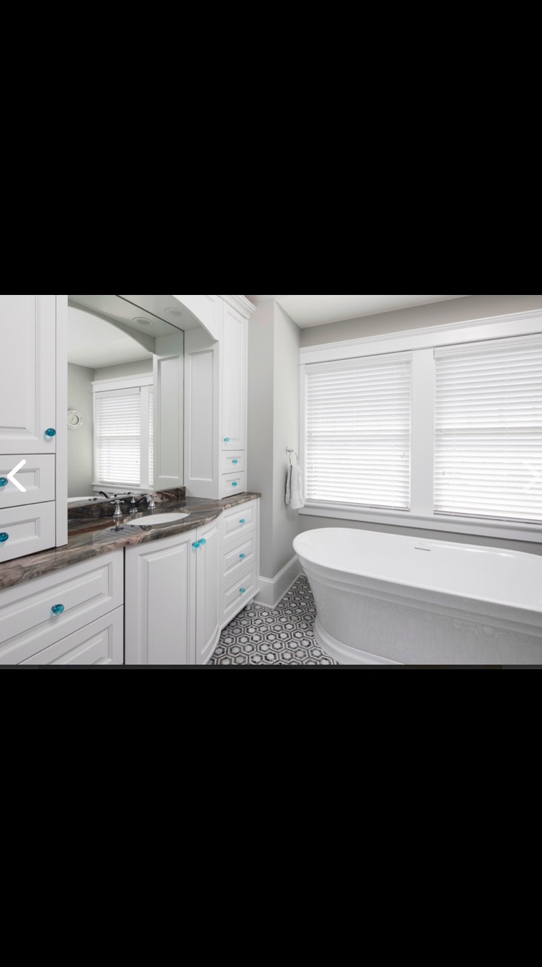Custom bathroom vanity with freestanding tub — Cole James Builders